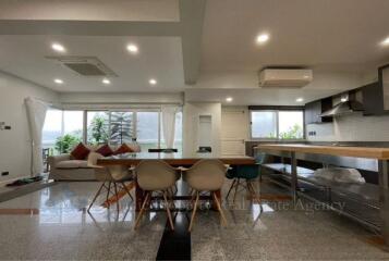 Modern open-plan living area and kitchen with natural light