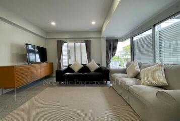 spacious living room with modern furniture and natural light