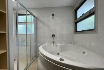 Bathroom with bathtub and shower area