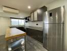 Modern kitchen with stainless steel appliances