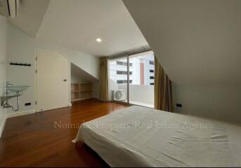 Spacious bedroom with balcony access