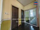 Hallway with wooden door and glass sliding doors