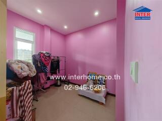 Small bedroom with pink walls