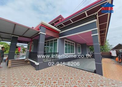 Exterior of a modern house with a tiled patio