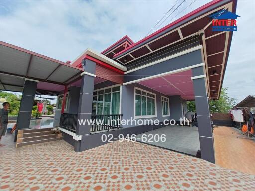 Exterior of a modern house with a tiled patio