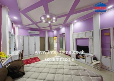 Spacious bedroom with modern lighting and storage space