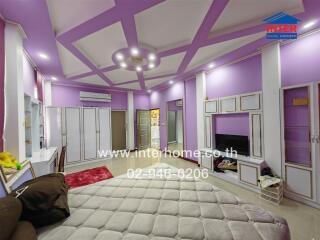 Spacious bedroom with modern lighting and storage space