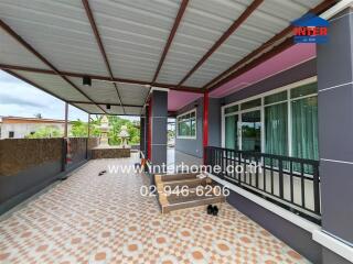 Covered outdoor area with tiled flooring