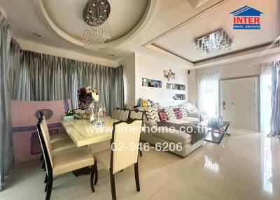 Modern living room with dining space and chandelier