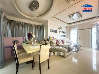 Modern living room with dining space and chandelier