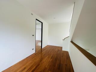 Spacious hallway with wooden flooring