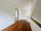 Spacious hallway with wooden flooring