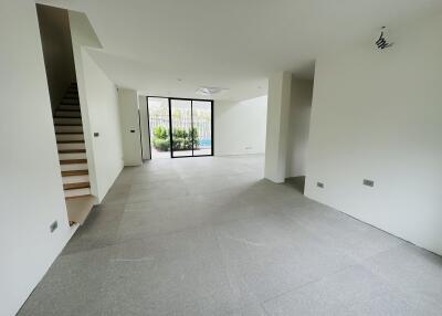 Modern living room with large windows and garden view