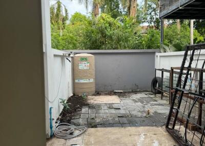 Outdoor area with tiled flooring and plants