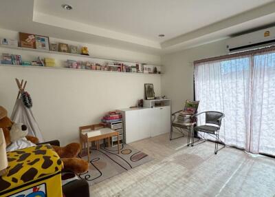 Living room with natural light and toys