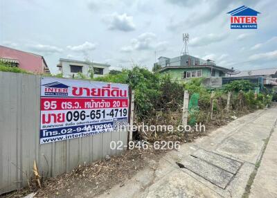 Exterior of a building with a real estate sales sign