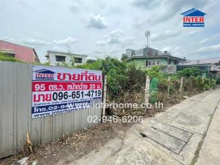 Exterior of a building with a real estate sales sign