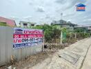 Exterior of a building with a real estate sales sign