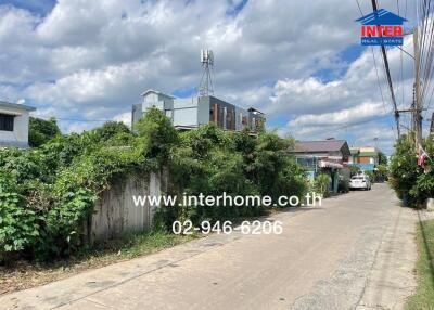 View of residential street with houses and greenery