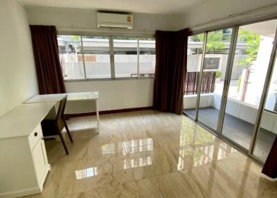 Spacious living area with large windows