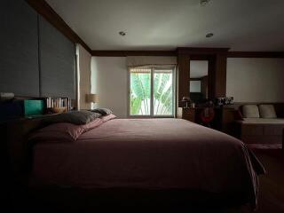 Spacious bedroom with large window and natural light