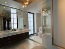 Modern bathroom with chandelier lighting and double sinks