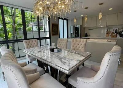 Elegant dining area with marble table and chandelier