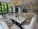 Elegant dining area with marble table and chandelier