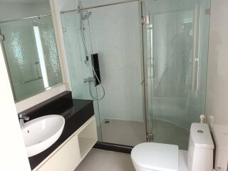 Modern bathroom with glass shower and vessel sink