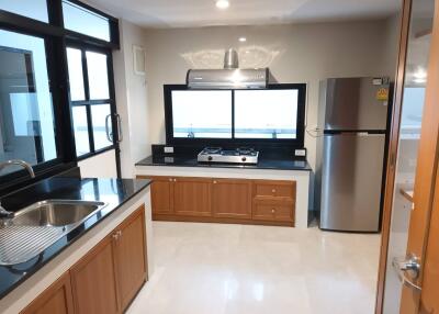 Modern kitchen with stainless steel appliances and wooden cabinets