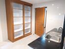 Modern kitchen with built-in cabinets and stainless steel sink