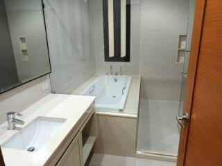 Modern bathroom with bathtub and shower area