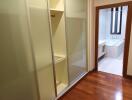 Hallway with sliding wardrobe leading to bathroom