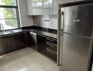 Modern kitchen with stainless steel appliances and sleek cabinetry