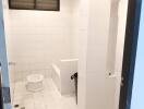 Bathroom with white tiles and toilet