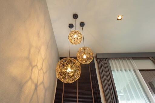 Modern pendant light fixtures in a stylish living room