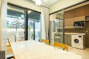 Modern kitchen and dining area with access to outdoor patio