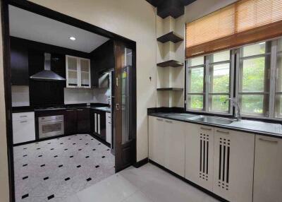 Modern kitchen with adjoining secondary cooking area