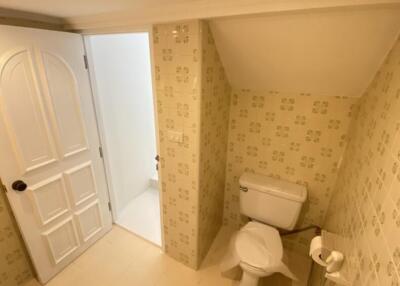 Small bathroom with floral tiles