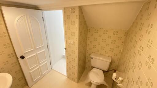 Small bathroom with floral tiles