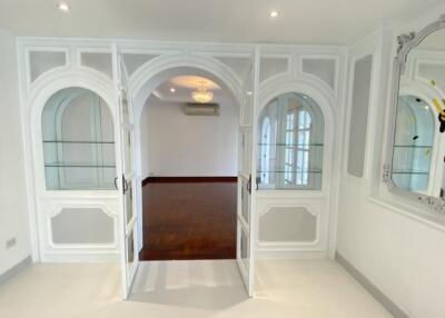 Elegant living area with arched glass doorways