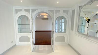 Elegant living area with arched glass doorways