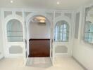 Elegant living area with arched glass doorways