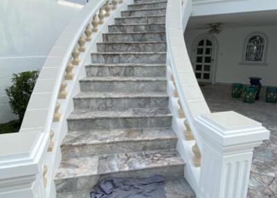 Elegant marble staircase leading to the upper level of a building