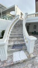 Elegant marble staircase leading to the upper level of a building