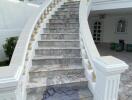 Elegant marble staircase leading to the upper level of a building