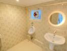 Bathroom with urinal, sink, and decorative tiles