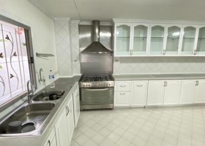 Modern white kitchen with stainless steel appliances