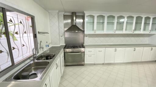 Modern white kitchen with stainless steel appliances