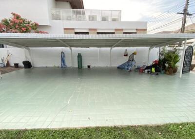 Covered parking area in front of the house